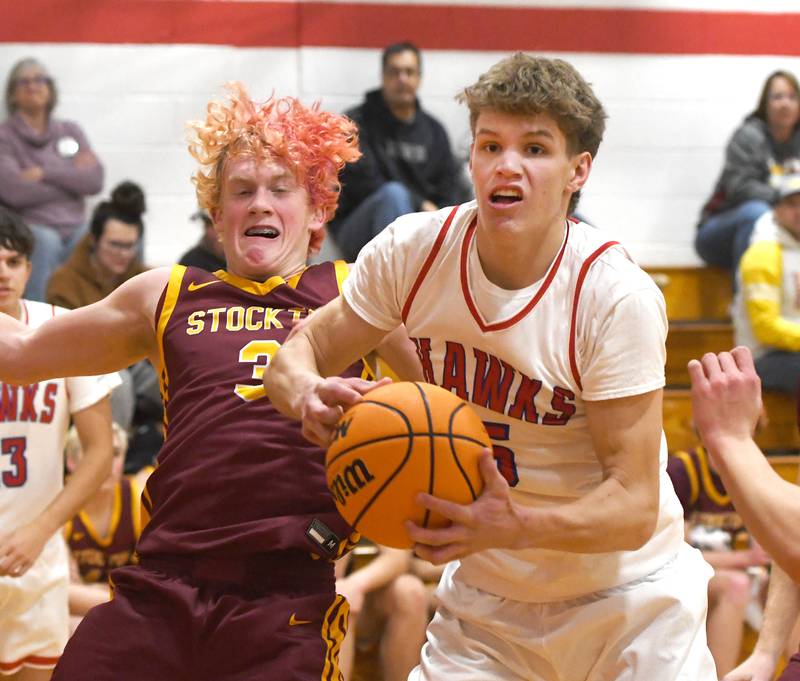 Oregon's Tucker O'Brien (5) and Stockton's Carter Blair (3) battle for a rebound on Saturday, Dec. 13 at the 64th Annual Forreston Holiday Basketball Tournament held at Forreston High School.