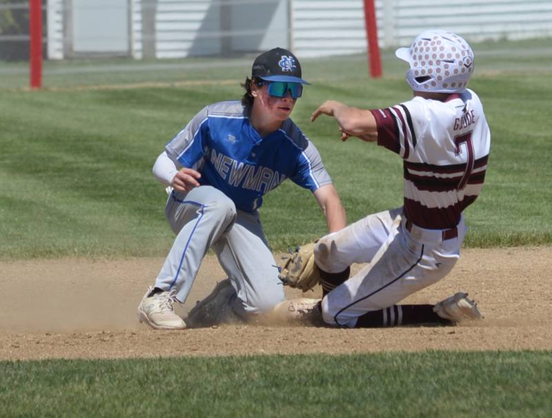 Newman's Garret Matznick tags out a Dakota baserunner at second base during the 1A Pearl City Sectional championship on Saturday, May 27.