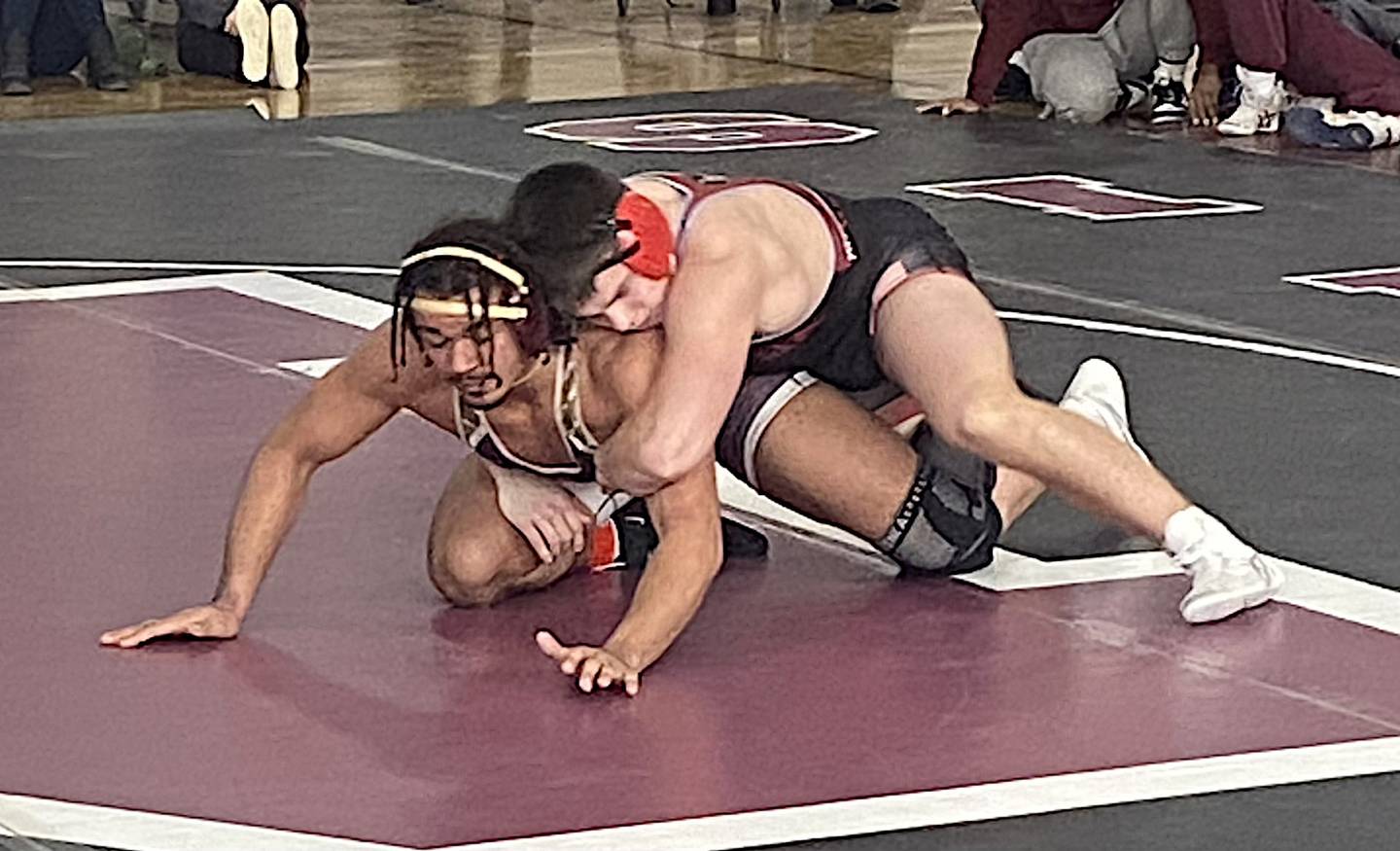 Ottawa's Wes Weatherford (right) rides Morris' Malachi Congo in the 190-pound title match at the Class 2A Morris Regional.