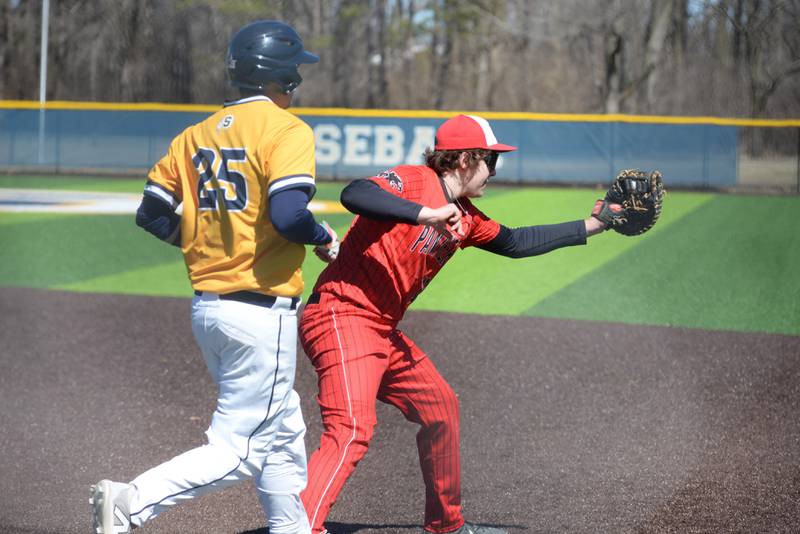 Erie-Prophetstown first baseman Eli Heyvaert catches a throw for an out as Sterling's James Leif  tries to beat it out during action on Saturday, March 22, 2025 in Sterling.