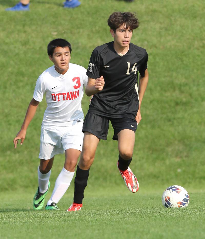 Sycamore's Javier Lopez controls the ball in front of Ottawa's Christian Solis during their game Wednesday, Sept. 14, 2022, at Sycamore High School.