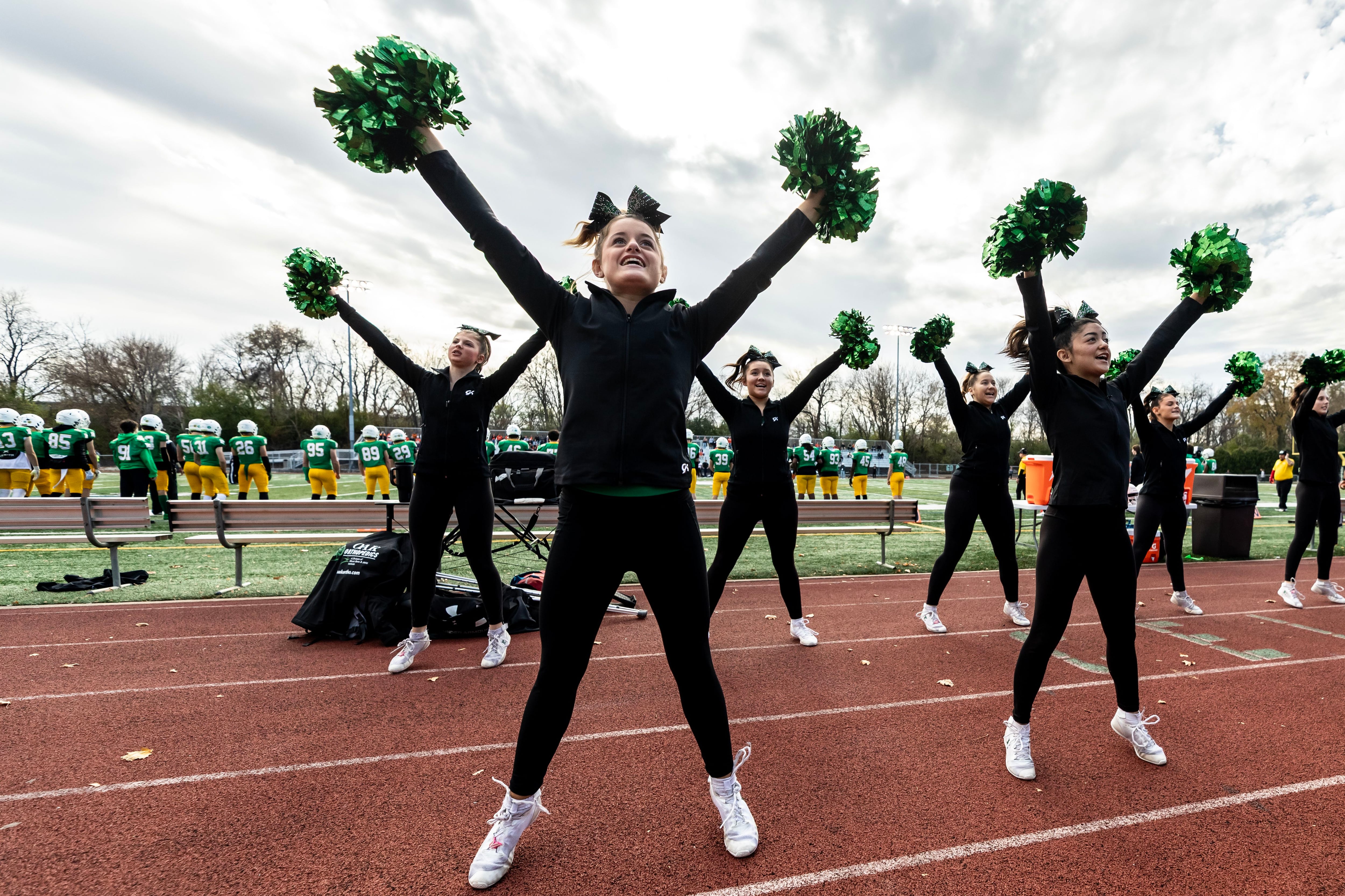 Providence’s varsity cheer team shares school spirit during a 5A varsity football playoff game against Washington at Providence on Nov. 15, 2025.