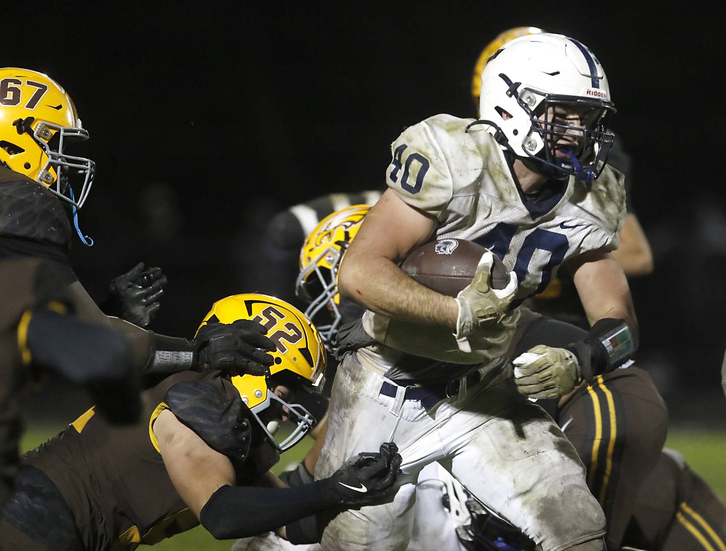 Cary-Grove's Logan Abrams powers through the Jacobs’ defense during a Fox Valley Conference football game on Friday, Oct. 24, 2025, at Jacobs High School in Algonquin.