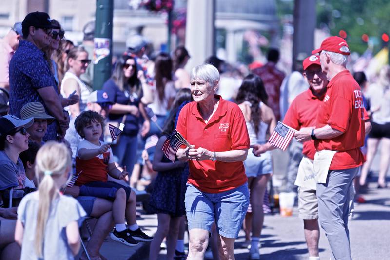 Tri - Cities Exchange hands out American flags out along the parade at the Memorial Day parade on Monday, May25,2026 in St. Charles.