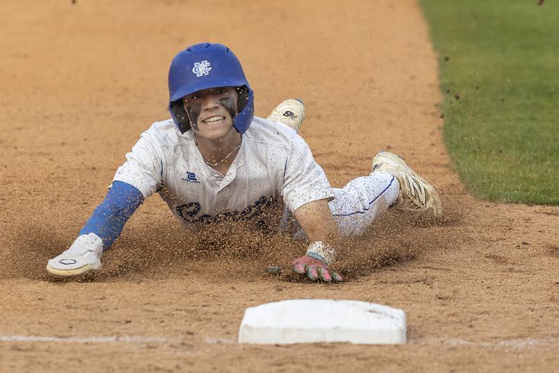 Newman’s Garret Matznick slides in safe at third against Chicago Hope Monday, June 2, 2025, during the Class 2A Supersectional at Northwestern Medicine Field in Geneva.