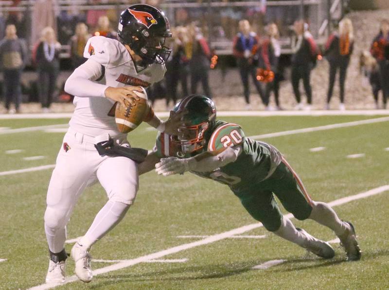 Metamora's quarterback Stephen Petri stiff arms L-P's Griffin May on Friday, Sept. 5, 2025 at Howard Fellows Stadium.