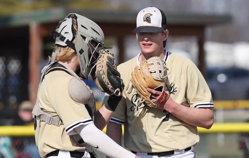 Sycamore pitcher Ethan Storm and catcher Byron Blaise meet on the mound during their game against LaSalle-Peru Monday, April 11, 2022, at the Sycamore Community Sports Complex.