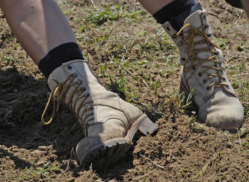 A tugger's boots dig in. The action took place as part of the Port Byron-hosted Great River Tug Fest across the Mississippi on Saturday, Aug. 10, 2024