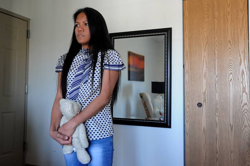 Wilma Alex holds a teddy bear Thursday, April 21, 2022, at her apartment in McHenry County as she talks about being nearly killed in early March. Her husband, Mark Alex, was charged with attempted first-degree murder.
