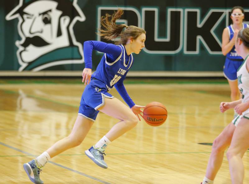Lyons' Ella Ormsby (20) drives the ball up court during the girls varsity basketball game between Lyons Township and York high schools on Friday, Dec. 16, 2022 in Elmhurst, IL.