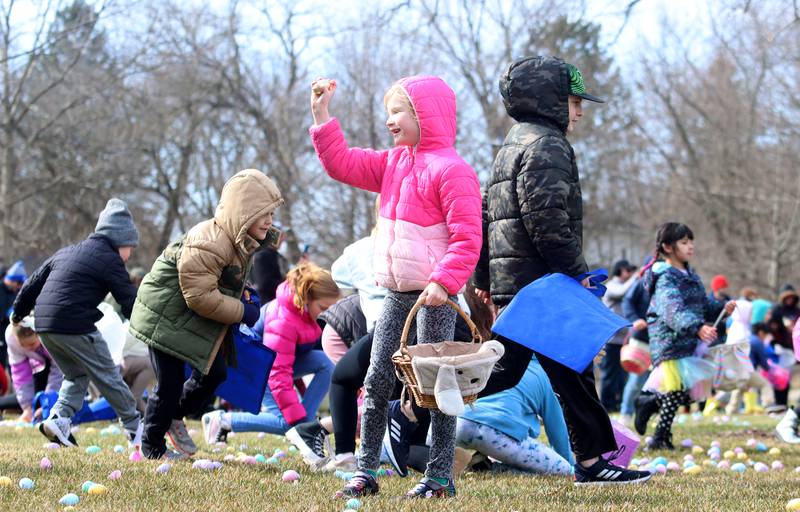 Children pick up eggs Sunday, April 2, 2023, during the Algonquin Egg Hunt at Towne Park.