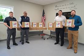 Comcast donates 50 laptops to We Care of Grundy County