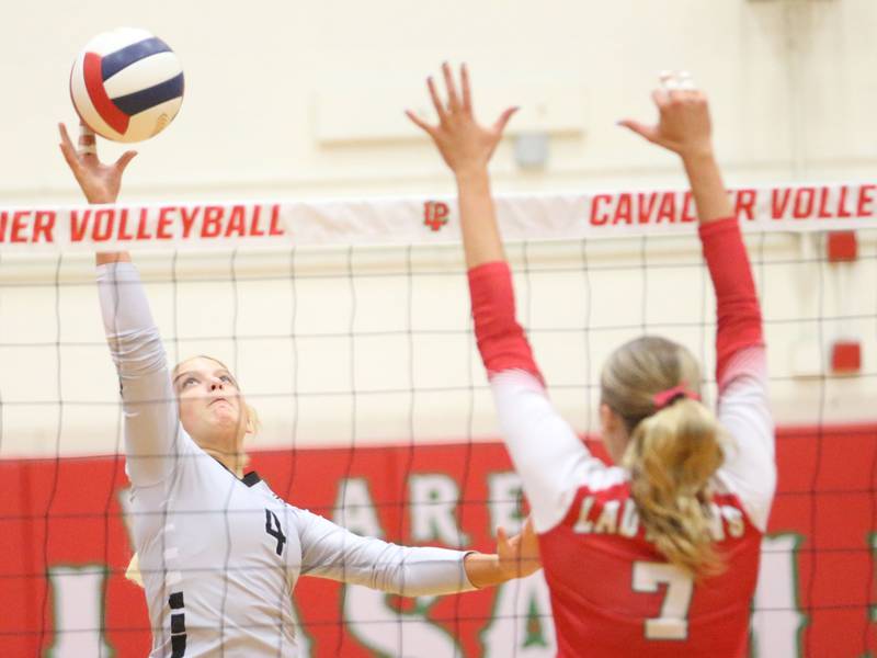 Kaneland's Mylee Crosby sends the ball past L-P's Aubrey Duttlinger on Tuesday, Oct. 7, 2025 in Sellett Gymnasium at L-P High School.