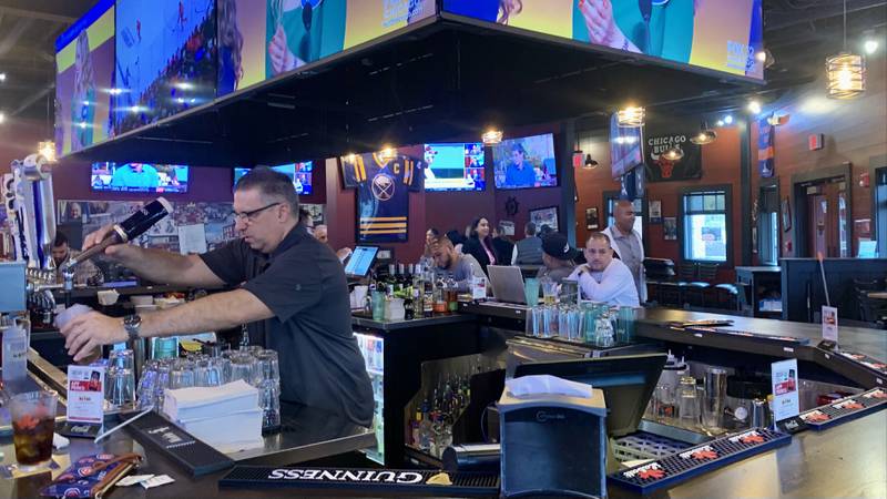 Anchor Bar owner Samm Dimech pours a pint of beer for a guest during the lunch rush on Friday Nov. 4 2022. Anchor Bar opened in October at 2440 Route 34 in Oswego.