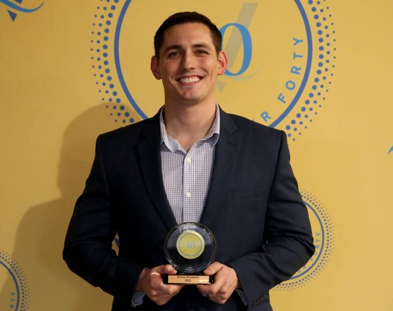 Danny Dresbach poses for a photo with his award during the 40 Under Forty awards banquet on Thursday, March 21, 2024 at Westclox in Peru.