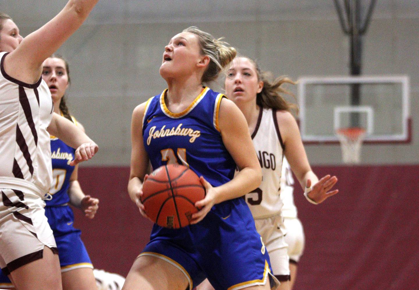 Johnsburg’s Sophie Person works under the hoop in varsity girls basketball at Marengo Tuesday night.