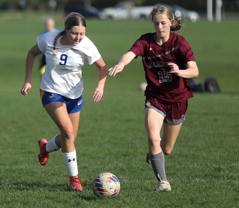 Johnsburg’s Brooke Butler controls the ball as she id defended by Marengo's Sophie Hanson during a Kishwaukee River Conference soccer match on Wednesday, April 15, 2026, at Marengo High School.