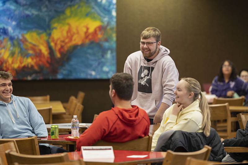 Josh Olson of Sterling reacts to his chosen card being picked Wednesday, Nov. 16, 2022 during the performance of illusionist Christopher Carter at Sauk Valley Community College.