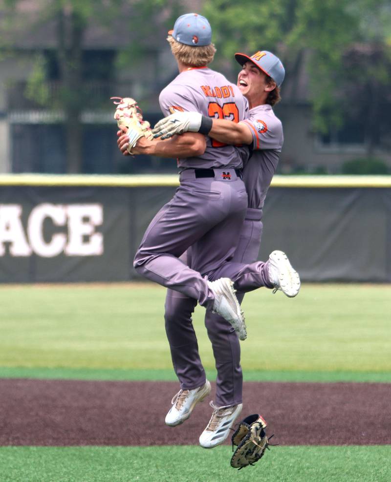 McHenry’s Kyle Maness, right, and Zachary Ready begin to celebrate the final out against Barrington in IHSA Class 4A Sectional Title Game baseball action at McHenry High School in McHenry on Saturday, June 7, 2025.