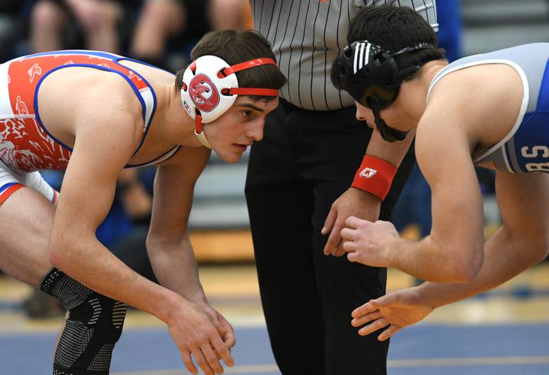 Oregon's Seth Stevens (eft) and Princeton's Augie Christiansen begin their championship place match at 145 pounds at the 1A Polo Wrestling Regional held at Eastland High School on Saturday, Feb. 4.