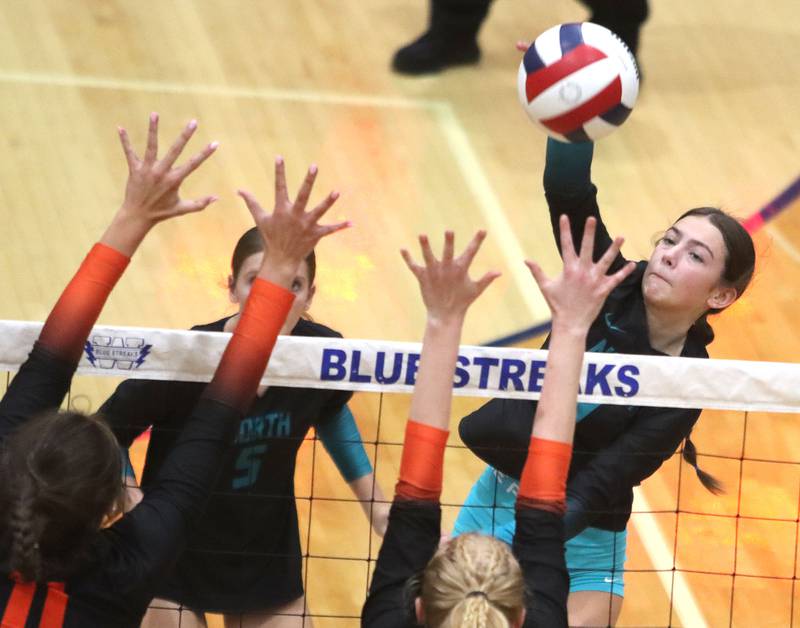 Woodstock North’s Jenna Johnson hammers the ball against Crystal Lake Central in IHSA girls volleyball Class 3A Regional action at Woodstock High School in Woodstock on Thursday, October 30, 2025.