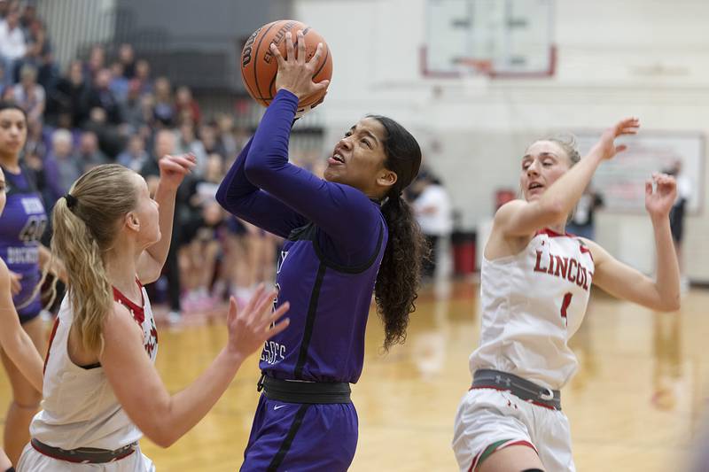 Dixon’s Ahmyrie McGowan puts up a shot against Lincoln in the class 3A super sectional Monday, Feb. 26, 2024 at LaSalle-Peru High School.