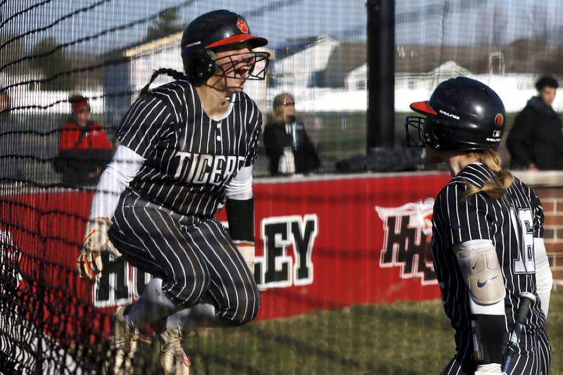Crystal Lake Central's Adi Waliullah celebrates scoring a run against against Huntley with her teammate, Cassidy Murphy, during Fox Valley Conference softball game on Tuesday, April 8, 2025, at Huntley High School.