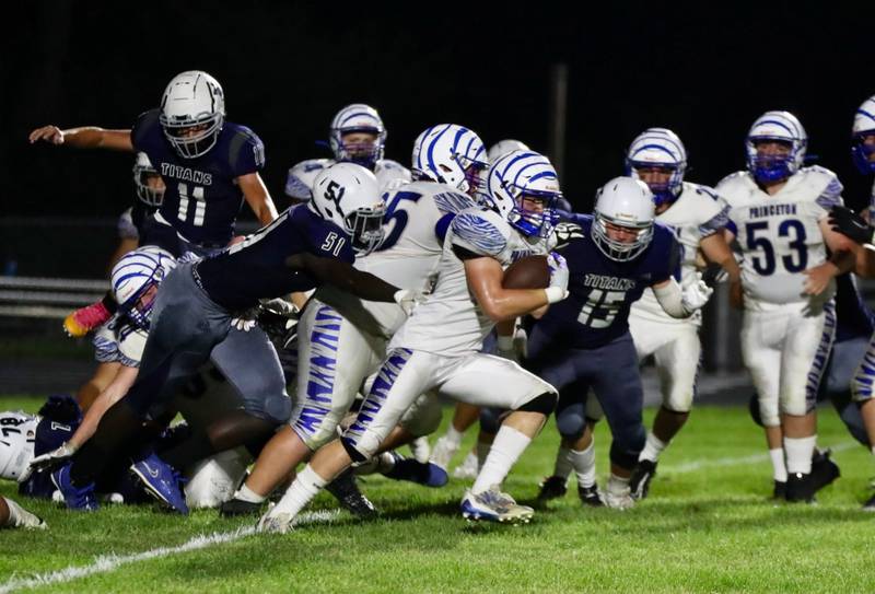 Princeton's Casey Etheridge gets loose at Monmouth-Roseville Friday night. Princeton won 40-0.