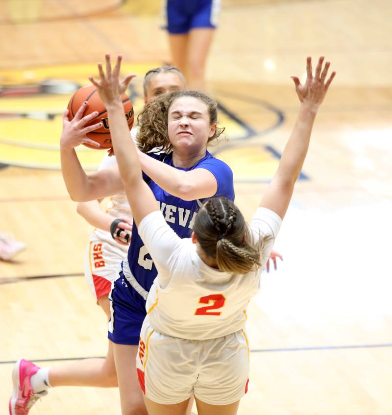 Geneva’s Kinsey Gracey gets tangled up by the Batavia defense on her way to the basket during the Class 4A Batavia Sectional final on Thursday, Feb. 22, 2024.