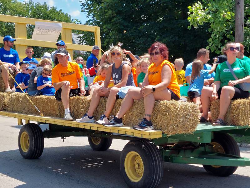 Marseilles summer league participants ride Sunday, July 9, 2023, through the Fun Days parade.