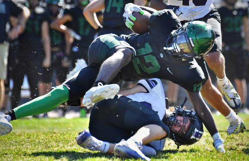 Glenbard West's Teyoin Oriental (12) is brought down by Downers Grove North's Jake Gregorio during a game on Sep. 9, 2023 at Glenbard West High School in Glen Ellyn.
Jon Cunningham for Shaw Local News Network