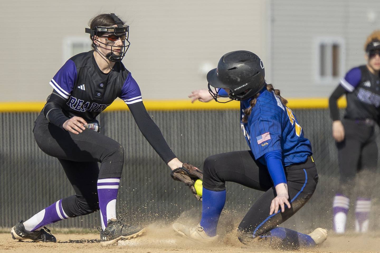 Plano's second baseman Taylor Downs applies the tag on a Somonauk baserunner during Monday's game in Plano.
