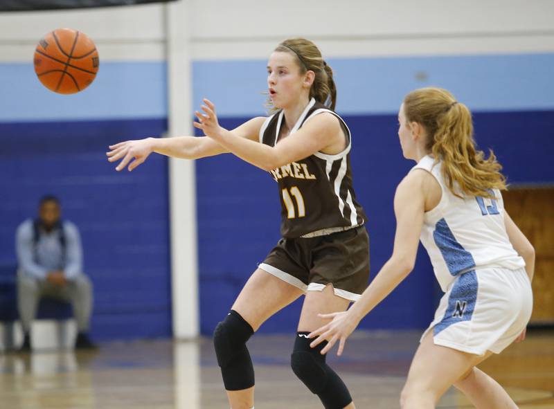 Carmel's Ashley Schlabowske (11) passes the ball during the girls varsity basketball game between Carmel High School and Nazareth Academy on Wednesday, Dec. 7, 2022 in LaGrange, IL