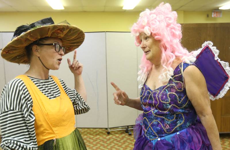 Jennifer Walk and Cyndy Bruch act out a scene during a rehearsal of Shrek the Musical on Monday, Oct. 13, 2025 at the Henry United Methodist Church. The River Valley Players are staging Shrek the Musical, with performances scheduled for Nov. 15-16 and 21-22, 2005 at the Henry United Methodist Church in Henry