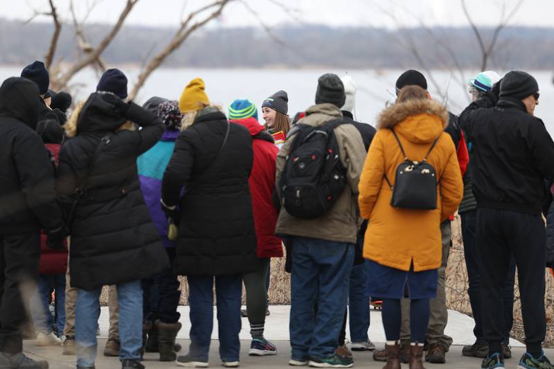 A tour guide leads a group on an interactive hiking tour at the Four Rivers Environmental Education Center’s annual Eagle Watch program in Channahon.