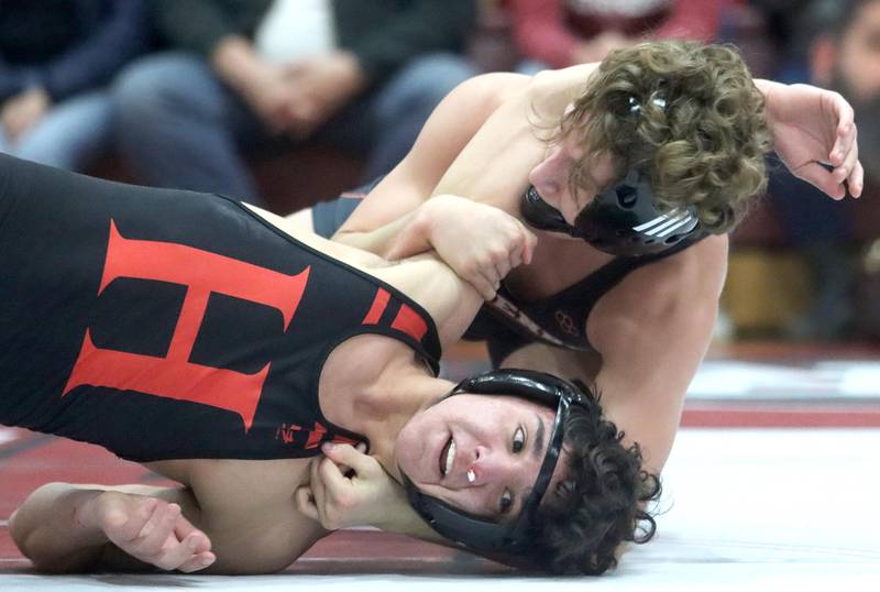 Huntley’s Alex Napientek (bottom) battles McHenry’s Pedro Jimenez at 145 pounds in their Fox Valley Conference dual on Friday in Huntley.