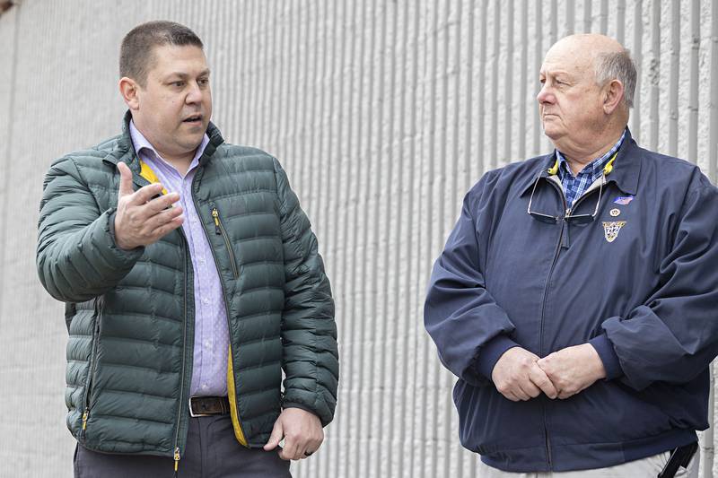 Investor Chris Williams gestures while speaking with Sterling Mayor Skip Lee on Tuesday, April 4, 2023 outside of the former Kmart building. Williams is redeveloping the site.