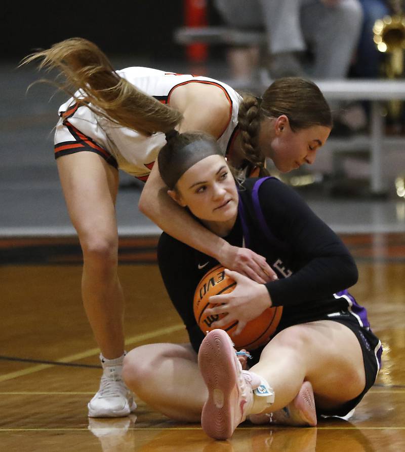 Crystal Lake Central's Hadley Ferrero battles with \hp20 for a loose ball during a a Fox Valley Conference basketball game on Friday, Feb. 7, 2025, at Crystal Lake Central High School.