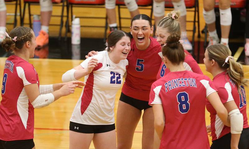 Princeton volleyball players (from left) Ava Kyle, Camryn Driscoll, Keely Lawson, Caroline Keutzer, Keighley Davis and Makayla Hecht react after scoring a point against Hall on Thursday, Oct. 9, 2025 at Hall High School.
