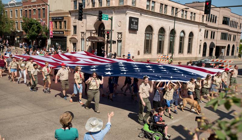 Boy Scouts and Cub Scouts carry a huge American Flag in the St. Charles Memorial Day Parade on Monday, May 29, 2023.