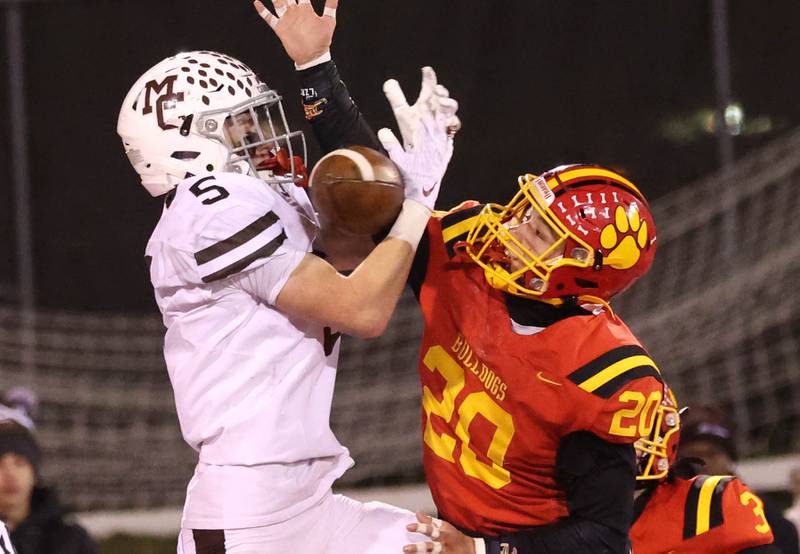 Batavia's Chase Osborne knocks the ball away from Mt. Carmel's Cooper Lehman during their Class 8A state championship game Saturday, Nov. 30, 2024, in Hancock Stadium at Illinois State University in Normal.