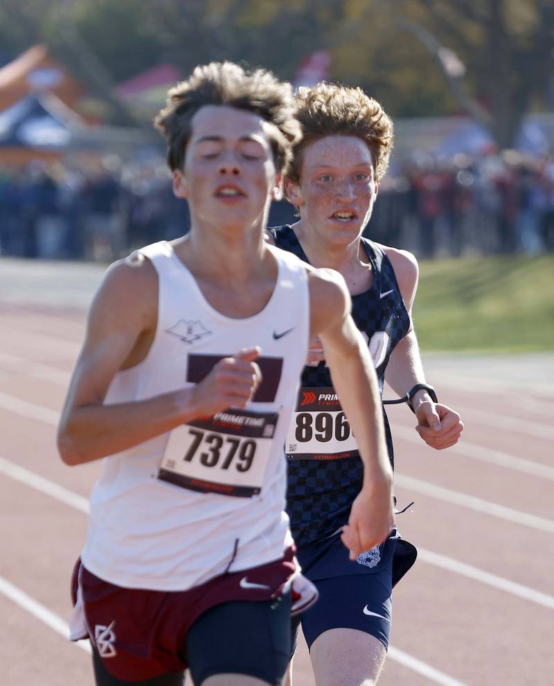 Cole Tupper of Elgin, left, and Judah McLean of West Chicago during the IHSA Class 3A Lake Park cross country sectional  Saturday, Nov. 2, 2024 in Roselle.