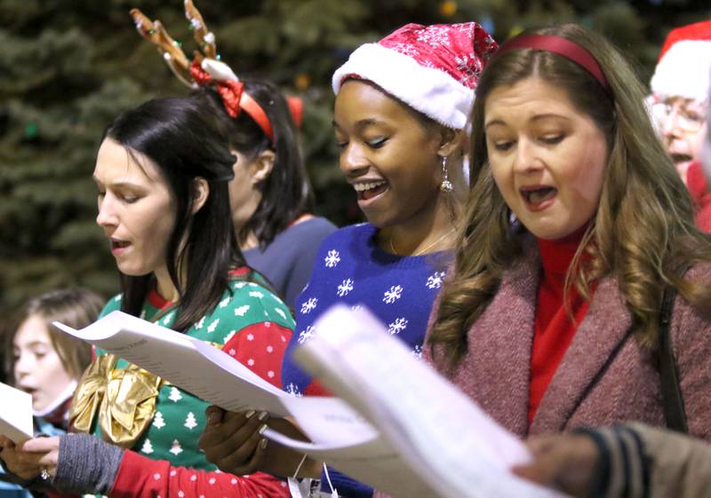 Members of the Stage Coach Players from DeKalb sing carols as the anticipation grows for Santa's arrival Thursday, Dec. 2, 2021, during Lights on Lincoln and Santa Comes to Town.