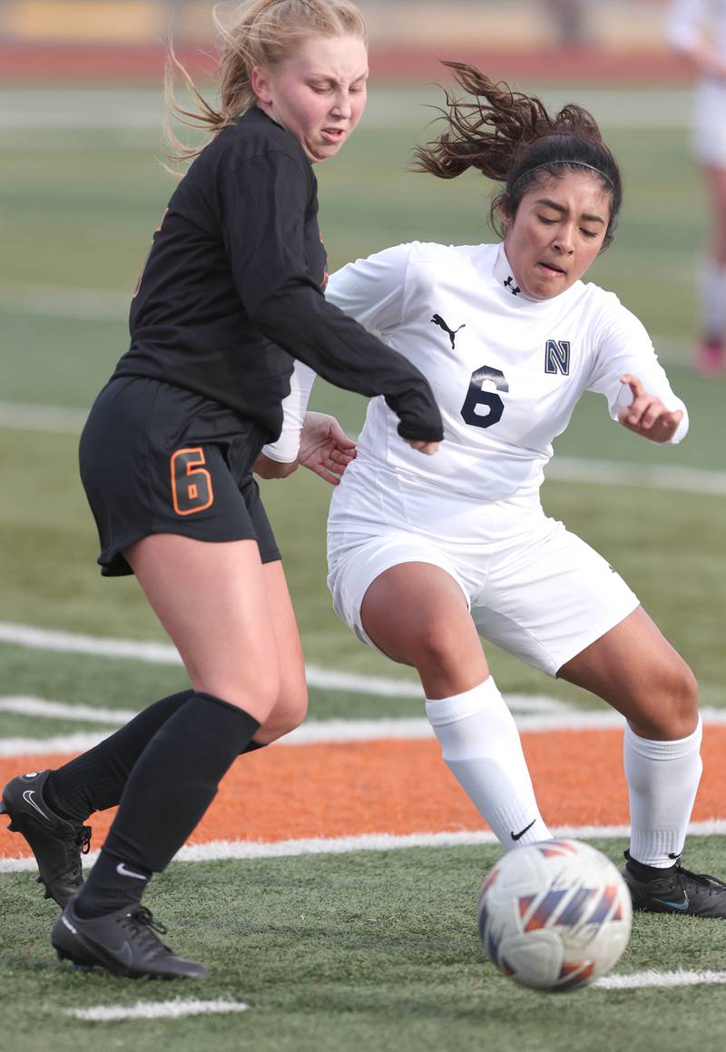 DeKalb’s Ashley Diedrich and Belvidere North’s Keyla Suarez fight for possession during their game Wednesday, March 15, 2023, at DeKalb High School.