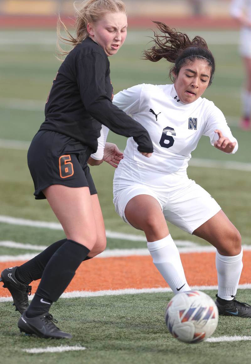 DeKalb’s Ashley Diedrich and Belvidere North’s Keyla Suarez fight for possession during their game Wednesday, March 15, 2023, at DeKalb High School.
