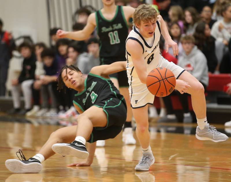 Fieldcrest's Jordan Heider steals the ball away from Rock Falls's Devin Tanton-DeJesus during the 49th annual Colmone Classic on Saturday, Dec. 9, 2023 at Hall High School.