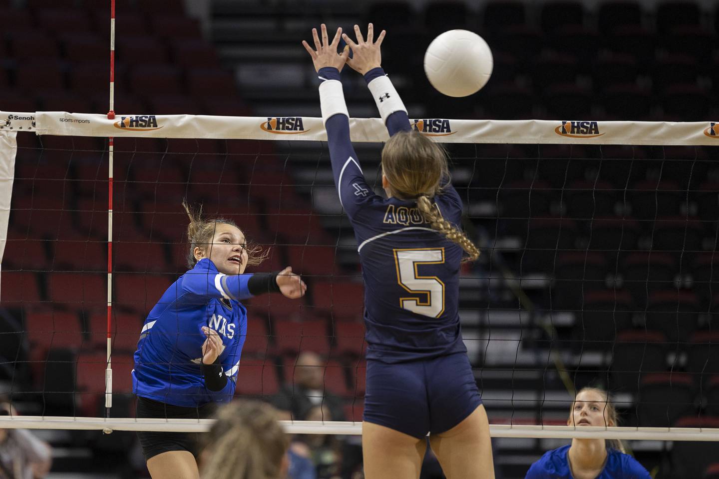 Newman’s Makenzie Duhon spikes the ball Friday, Nov. 11, 2022 in a class 1A volleyball semifinal against Aquin.