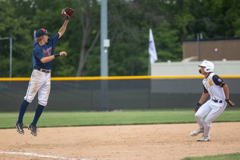 Dave Campbell (23) of Illinois leaps to catch ball as Sam Allen of Iowa looks to reach 3rd base on Thursday, July 17, 2025 at Washington Park in Peru.
