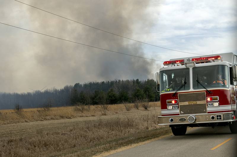 Dark smoke billows into the air Friday, March 14, 2025, at the scene of a wild fire at Green River State Wildlife Area.