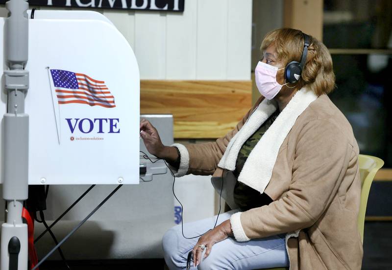 Patricia Doss, of DeKalb, uses one of the new touch screen voting machines on Election Day, Tuesday, Nov. 8, 2022, at the polling place in Westminster Presbyterian Church in DeKalb.
